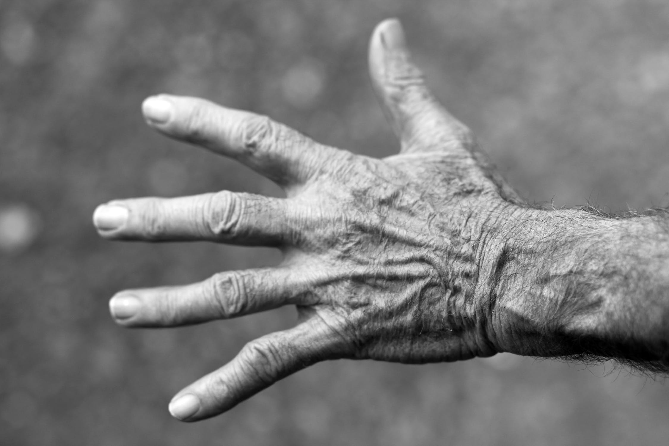 https://www.pexels.com/photo/hand-wrinkles-black-and-white-elderly-woman-54321/