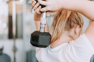 Person lifting dumbbell